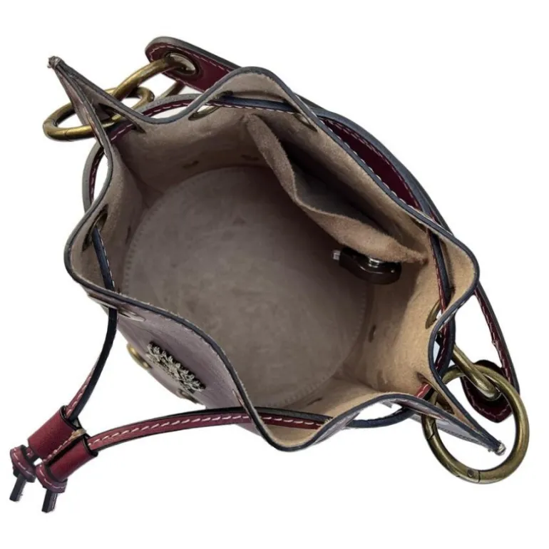 Mała skórzana listonoszka z ćwiekami CH